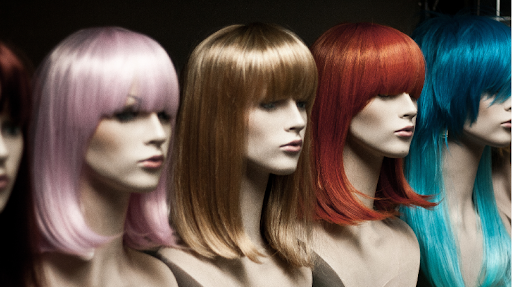 selection of different style women’s wigs (Image from Canva).