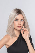 This classy look has a hand-tied middle part and an invisible lace front that looks natural